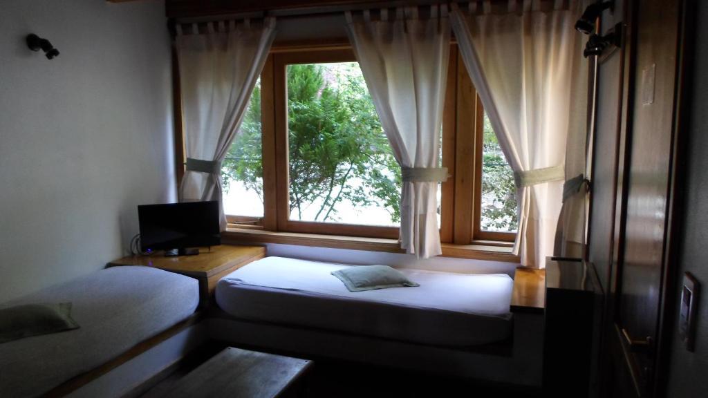Apart Hotel Robles Del Sur San Martín de los Andes Quarto foto